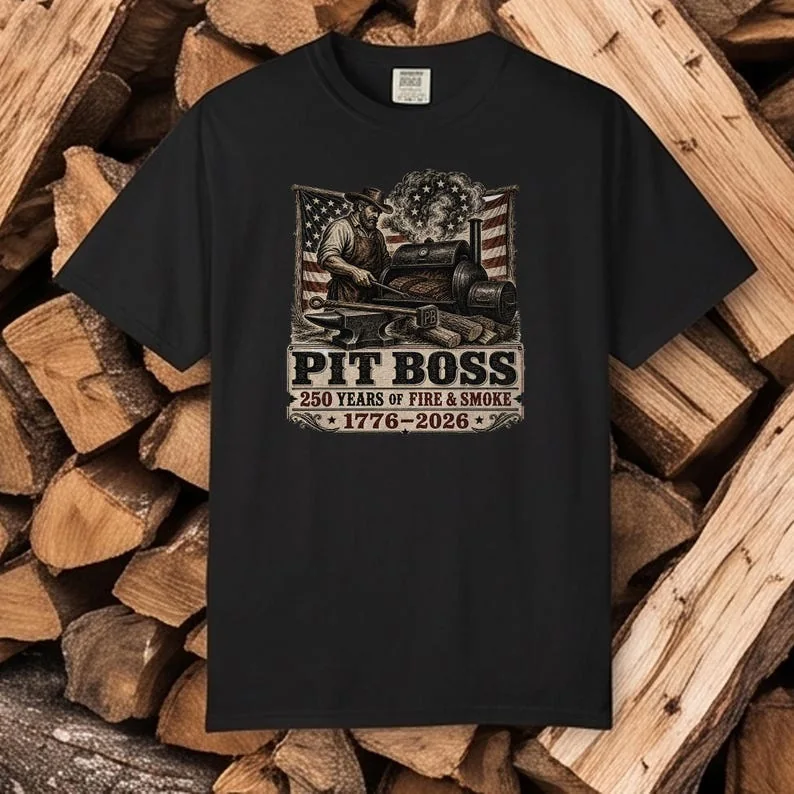 Comfort Colors 1717 black Pit Boss Woodcut BBQ T-shirt featuring vintage Americana smoker artwork celebrating America's 250th Anniversary.