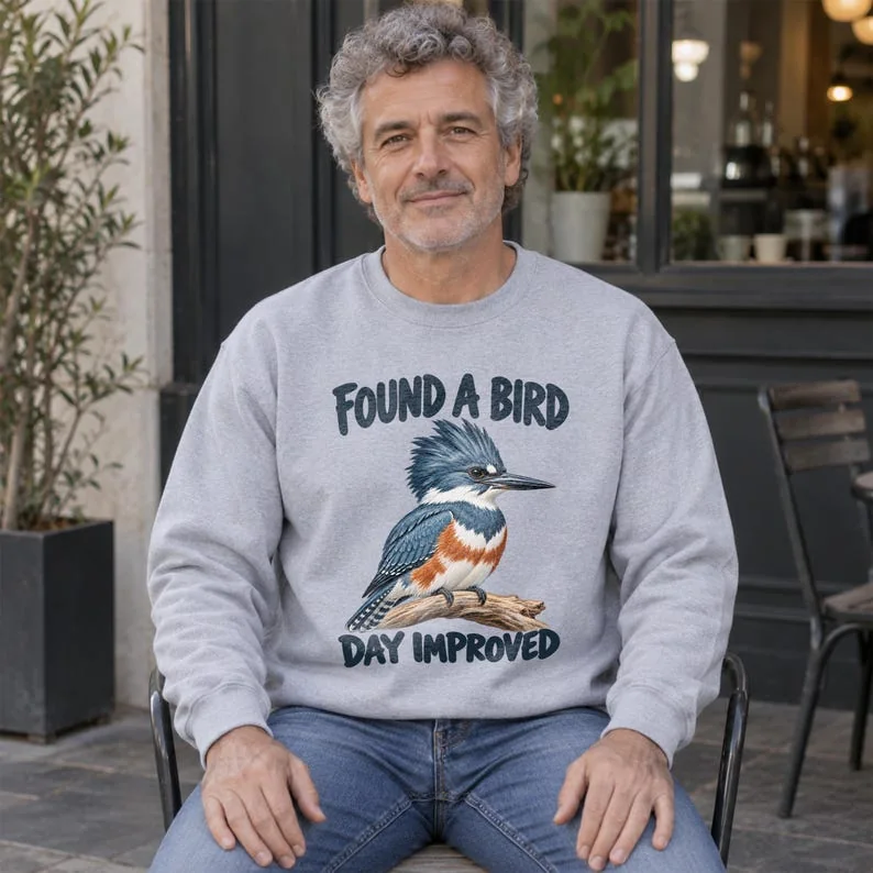 Sport grey birdwatching sweatshirt on older man, featuring kingfisher artwork and Found a Bird Day Improved text.